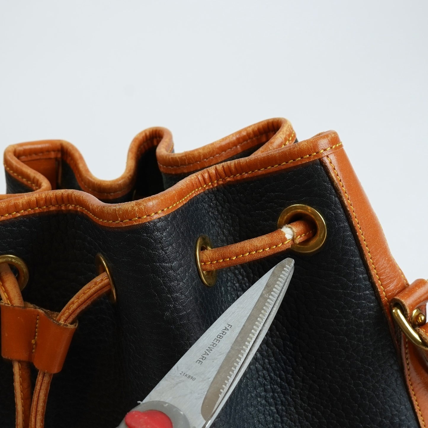 Dooney & Bourke Vintage Drawstring Bucket Bag Navy Brown Leather